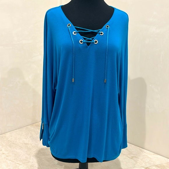Calvin Klein Women's stunning Blue-turquoise shade Lace up Long Sleeve Top.